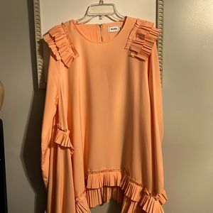 Very unique asymmetrical top! Super cute on!